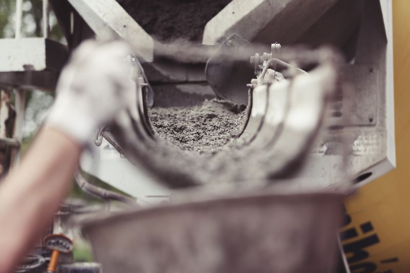 Fresh concrete being poured on a construction site